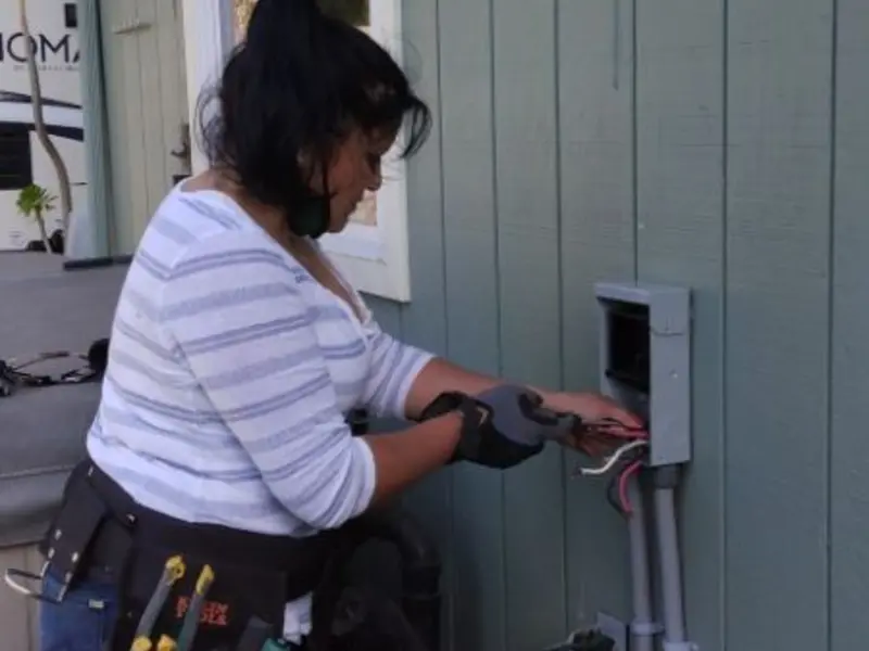 Licensed electrician wiring an exterior subpanel in Juniper Canyon