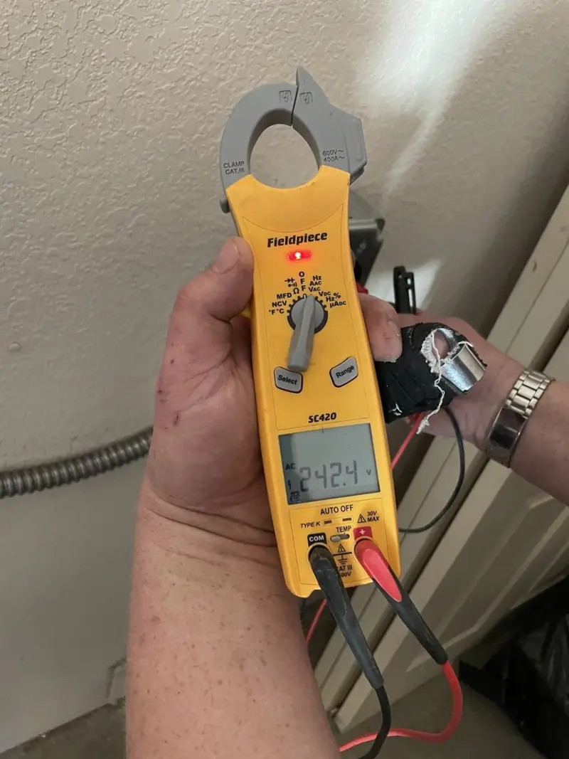 Voltage testing with clamp meter during Generator Installation in Juniper Canyon